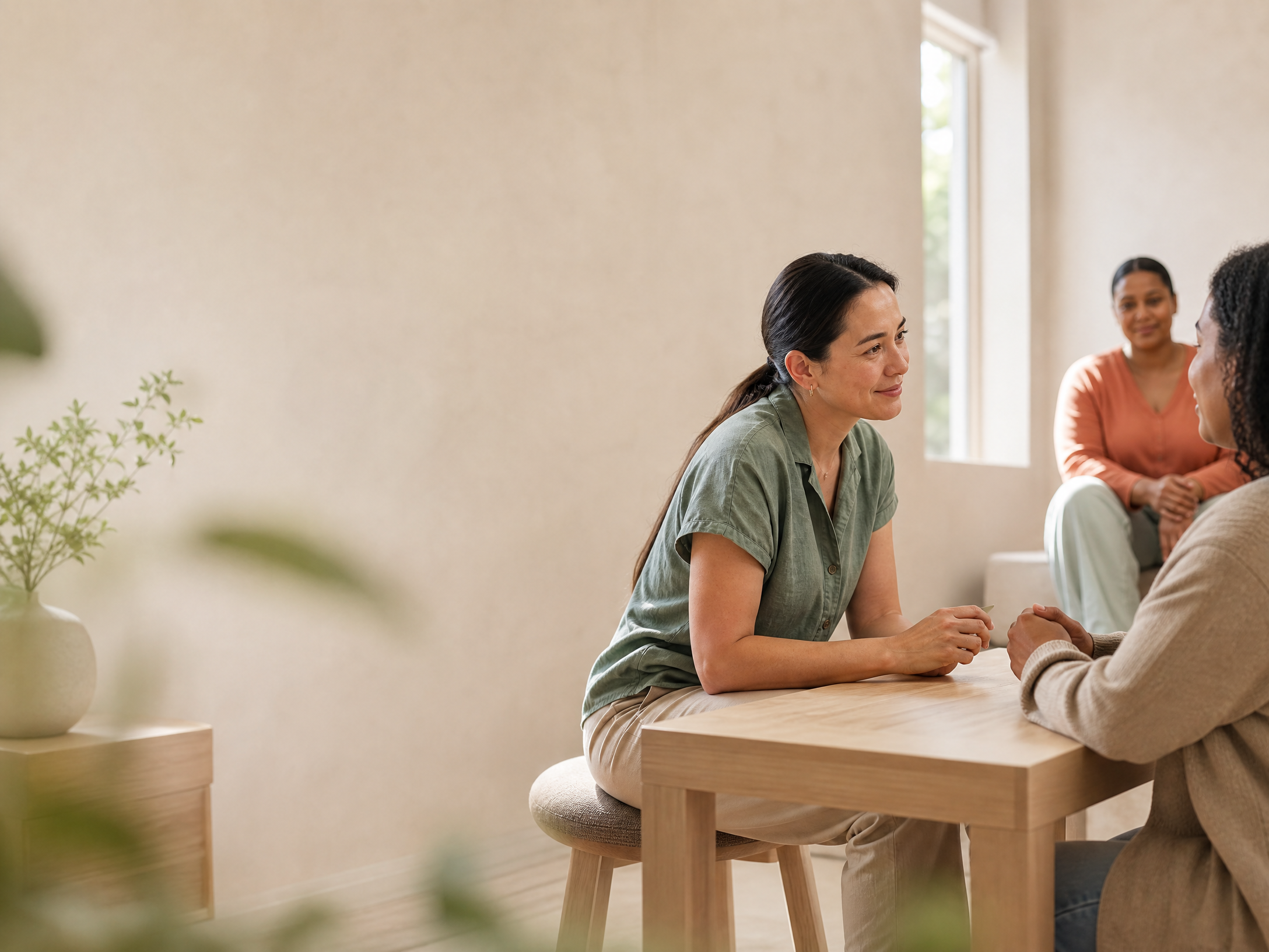 Speech therapist listening attentively during a calm consultation
